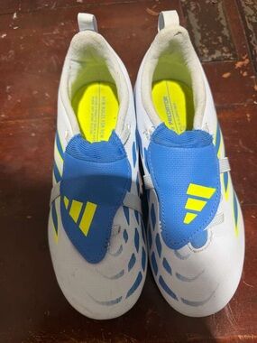 Kids White and Blue Soccer Sneakers with Neon Yellow Accents